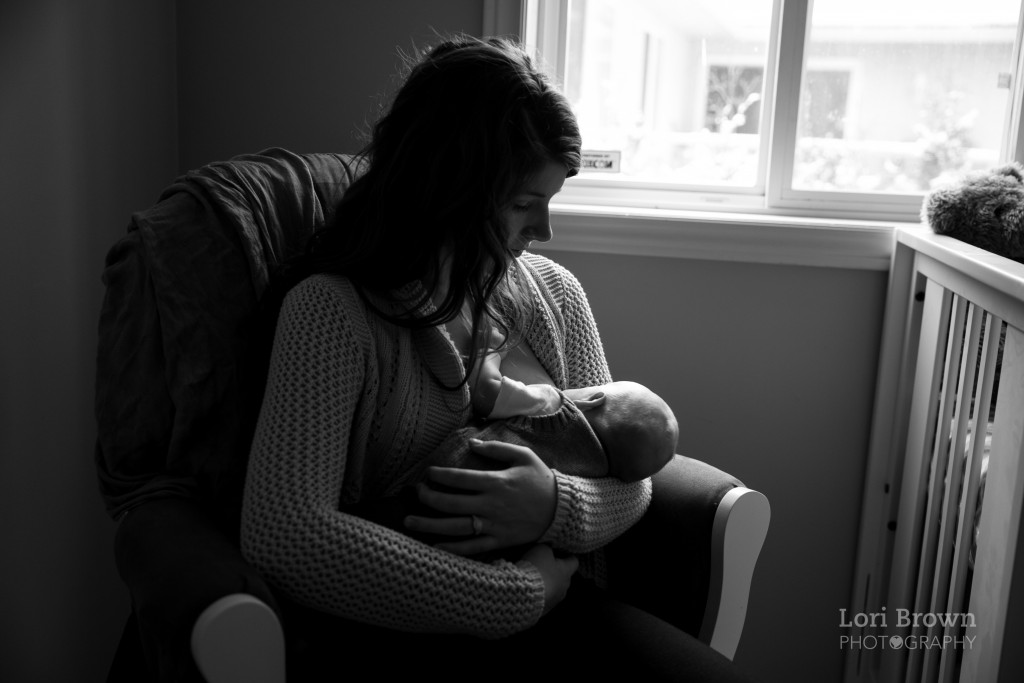 Kelowna newborn documentary session, nursing by window