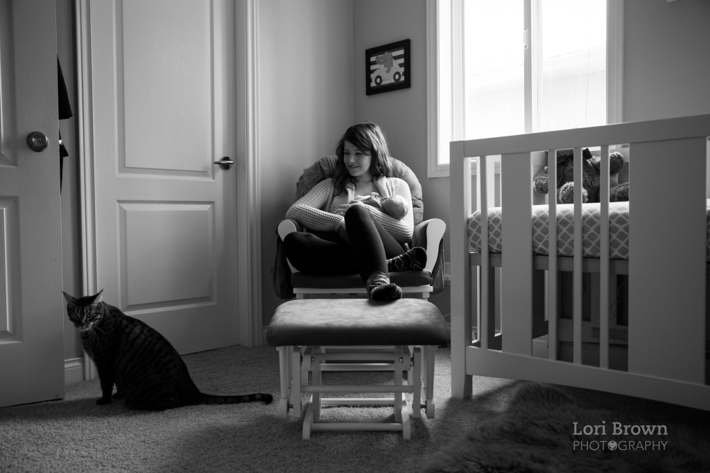 Kelowna newborn documentary session, nursing in chair