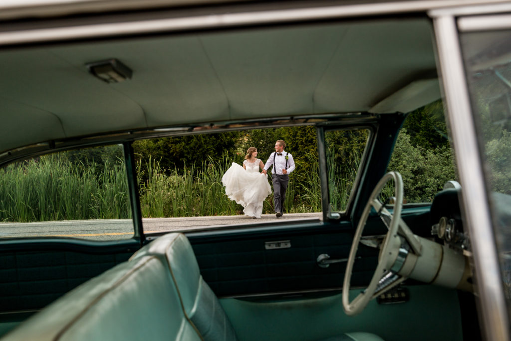Nanaimo & Vancouver Island Wedding Photographer | bride and groom running across street through car window